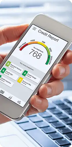 Hand holding phone with credit score