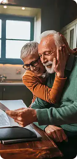 Happy Couple looking at computer
